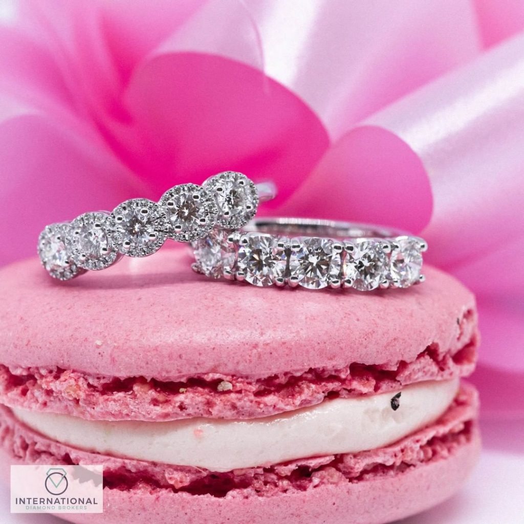 engagement rings on pink macaroon